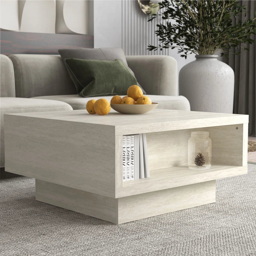 Light faux travertine-look square coffee table.