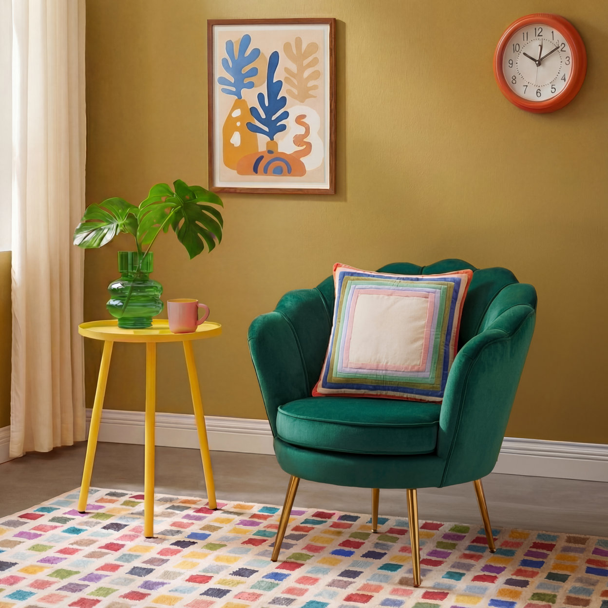 Green velvet chair with colorful pillow, framed art print, and modern furnishing